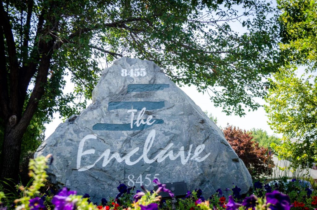 The Enclave logo at the front gate